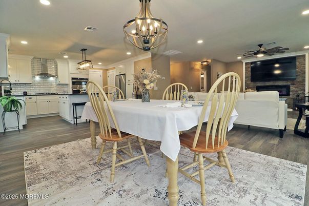 Dining room, Fireplace, Interior, Kitchen, Living room, Pendant Lights, Recessed Lighting, Stainless Steel Appliances, Wood Texture Flooring