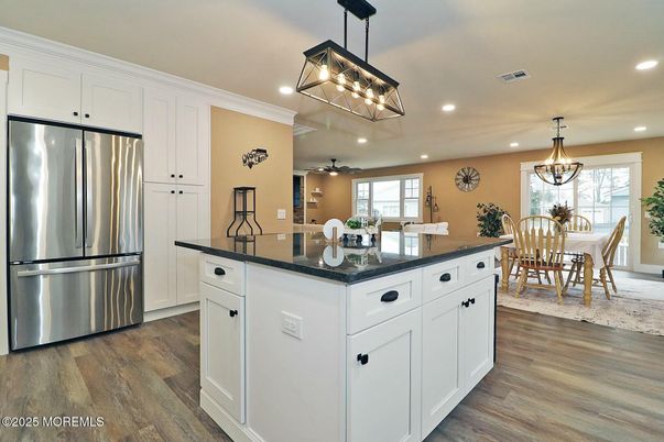 Chandelier, Dining room, Interior, Kitchen, Pendant Lights, Recessed Lighting, Stainless Steel Appliances, Wood Texture Flooring