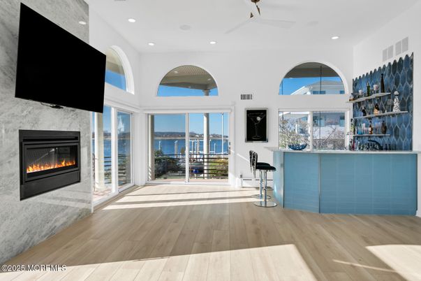 Fireplace, Interior, Recessed Lighting, Water, Wood Texture Flooring
