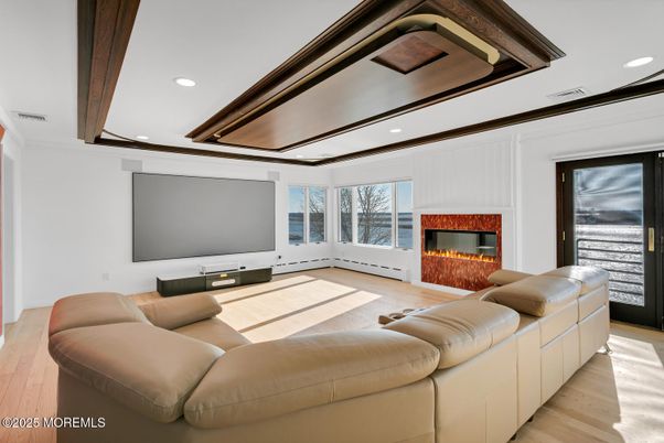 Fireplace, Interior, Living room, Projection Screen, Recessed Lighting, Wood Texture Flooring