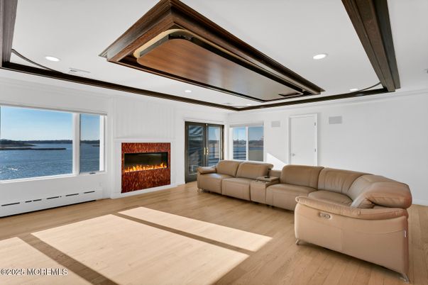 Fireplace, Interior, Living room, Recessed Lighting, Water, Wood Texture Flooring