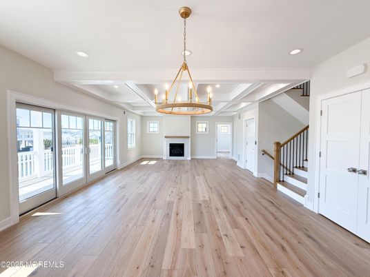 Chandelier, Empty room, Fireplace, Interior, Pendant Lights, Recessed Lighting, Wood Texture Flooring