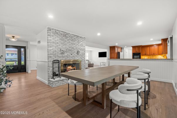 Dining room, Fireplace, Interior, Kitchen, Recessed Lighting, Stone Walls, Wood Texture Flooring