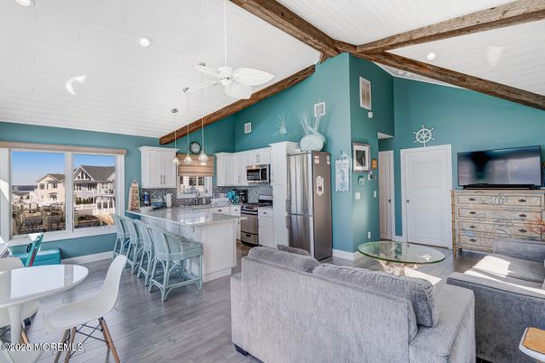 Dining room, Interior, Kitchen, Living room, Pendant Lights, Recessed Lighting, Stainless Steel Appliances, Wooden Beams, Wood Texture Flooring
