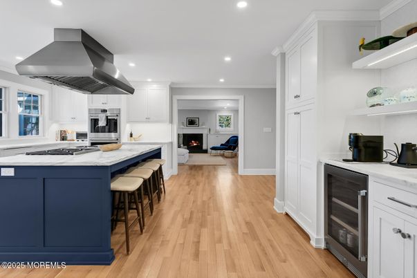 Fireplace, Interior, Kitchen, Recessed Lighting, Stainless Steel Appliances, Wood Texture Flooring