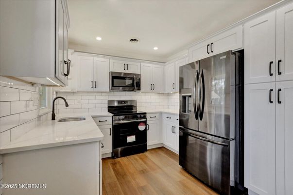 Interior, Kitchen, Recessed Lighting, Stainless Steel Appliances, Wood Texture Flooring