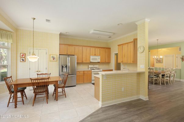 Chandelier, Dining room, Interior, Kitchen, Pendant Lights, Recessed Lighting, Stainless Steel Appliances, Wood Texture Flooring