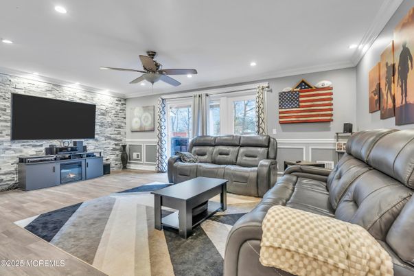 Fireplace, Interior, Living room, Recessed Lighting, Stone Walls, Wood Texture Flooring