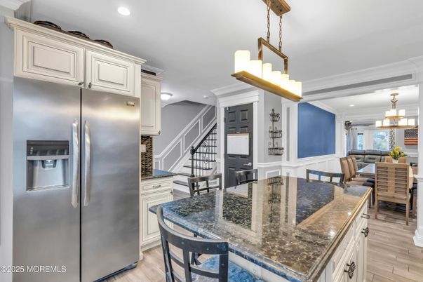 Chandelier, Dining room, Interior, Kitchen, Pendant Lights, Recessed Lighting, Stainless Steel Appliances, Wood Texture Flooring