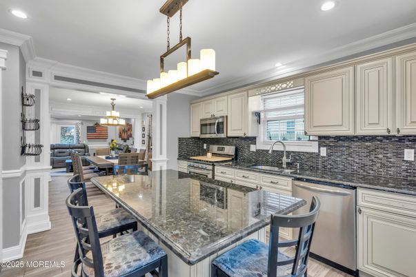 Chandelier, Dining room, Interior, Kitchen, Pendant Lights, Recessed Lighting, Stainless Steel Appliances, Wood Texture Flooring
