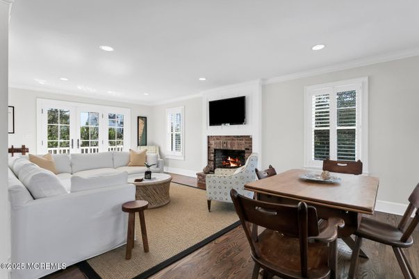 Dining room, Fireplace, Interior, Living room, Recessed Lighting, Wood Texture Flooring