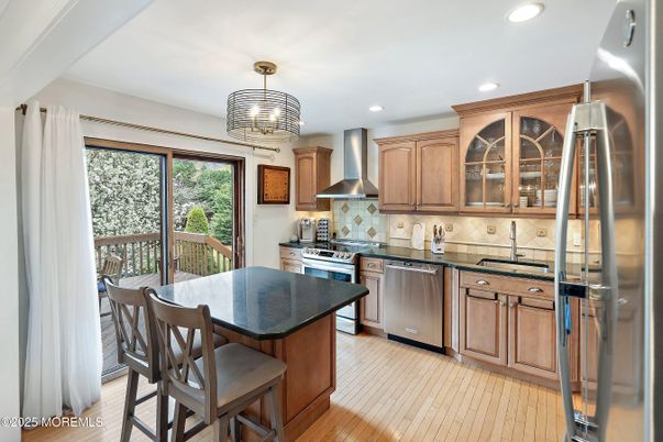 Dining room, Interior, Kitchen, Recessed Lighting, Stainless Steel Appliances, Wood Texture Flooring