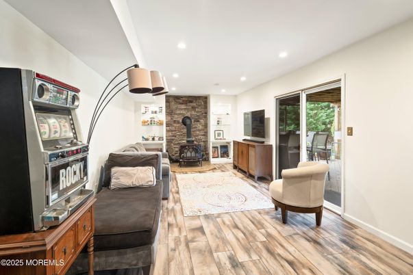 Fireplace, Interior, Living room, Recessed Lighting, Stone Walls, Wood Texture Flooring