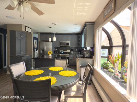 Dining room, Interior, Kitchen, Pendant Lights, Stainless Steel Appliances, Wood Texture Flooring