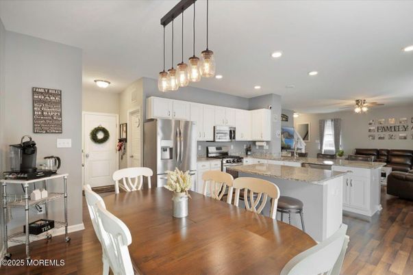 Dining room, Interior, Kitchen, Pendant Lights, Recessed Lighting, Stainless Steel Appliances, Wood Texture Flooring