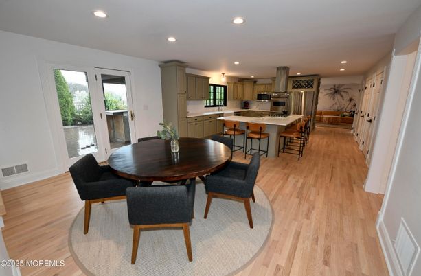 Dining room, Interior, Kitchen, Recessed Lighting, Stainless Steel Appliances, Wood Texture Flooring