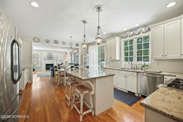 Dining room, Fireplace, Interior, Kitchen, Living room, Pendant Lights, Recessed Lighting, Stainless Steel Appliances, Wood Texture Flooring