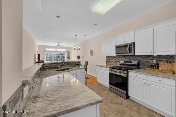 Chandelier, Dining room, Interior, Kitchen, Pendant Lights, Recessed Lighting, Stainless Steel Appliances