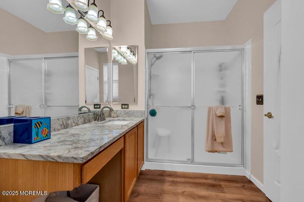 Bathroom, Dual Sink Vanities, Glass Shower, Interior, Wood Texture Flooring