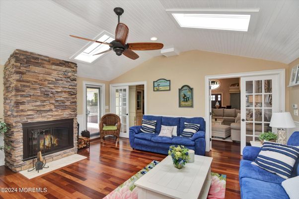 Fireplace, Interior, Living room, Recessed Lighting, Stone Walls, Wood Texture Flooring