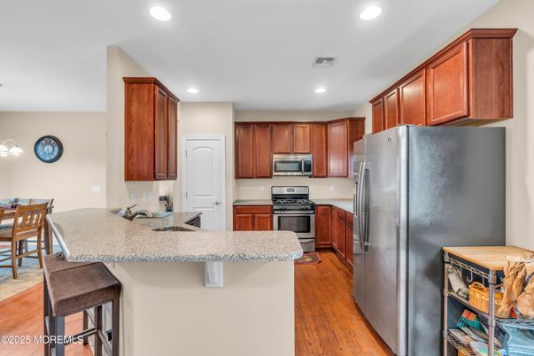Dining room, Interior, Kitchen, Recessed Lighting, Stainless Steel Appliances, Wood Texture Flooring