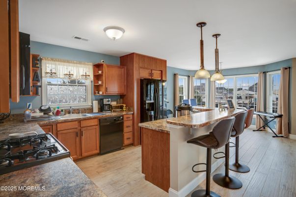 Dining room, Interior, Kitchen, Pendant Lights, Stainless Steel Appliances, Wood Texture Flooring