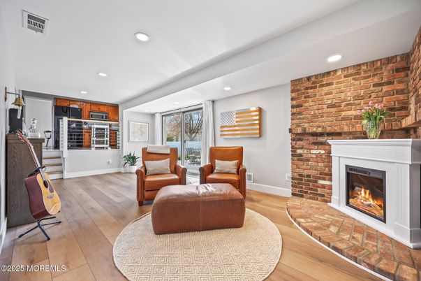 Fireplace, Interior, Kitchen, Living room, Recessed Lighting, Stone Walls, Wood Texture Flooring