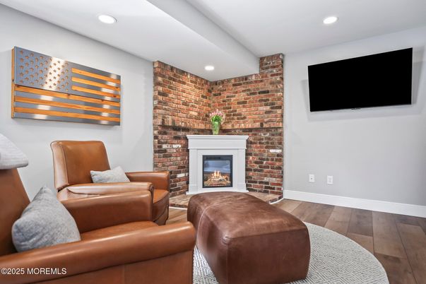 Fireplace, Interior, Living room, Recessed Lighting, Stone Walls, Wood Texture Flooring