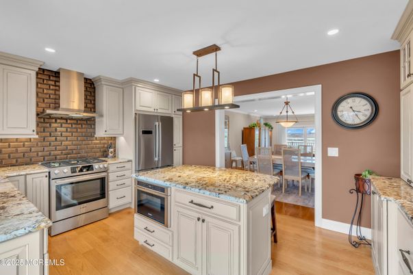 Dining room, Interior, Kitchen, Pendant Lights, Recessed Lighting, Stainless Steel Appliances, Wood Texture Flooring