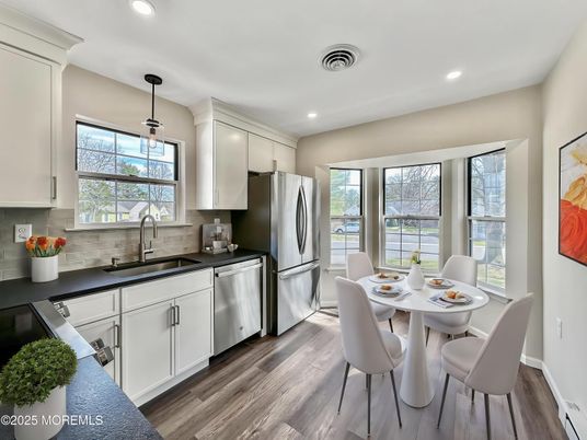 Dining room, Interior, Kitchen, Pendant Lights, Recessed Lighting, Stainless Steel Appliances, Wood Texture Flooring