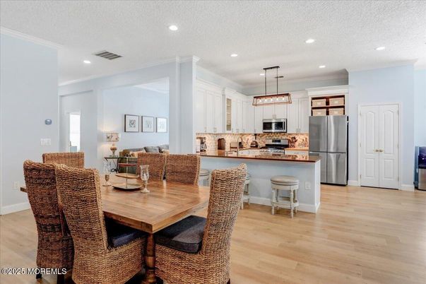Dining room, Interior, Kitchen, Living room, Pendant Lights, Recessed Lighting, Stainless Steel Appliances, Wood Texture Flooring