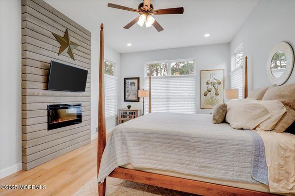 Bedroom, Fireplace, Interior, Recessed Lighting, Wood Texture Flooring