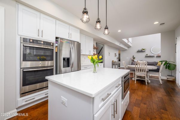 Dining room, Interior, Kitchen, Pendant Lights, Recessed Lighting, Stainless Steel Appliances, Wood Texture Flooring