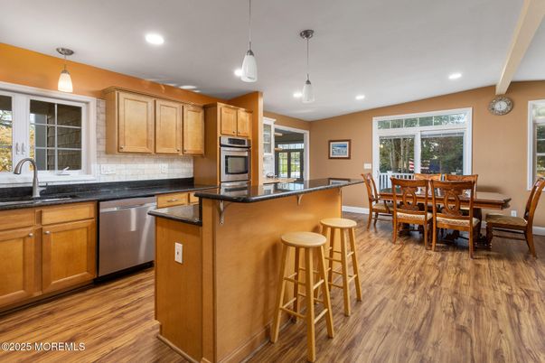Dining room, Interior, Kitchen, Pendant Lights, Recessed Lighting, Stainless Steel Appliances, Wood Texture Flooring