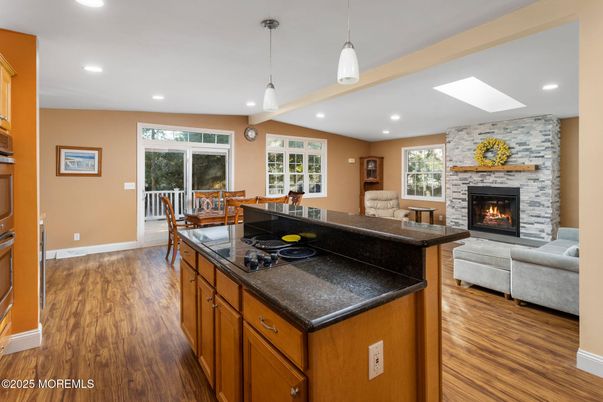 Dining room, Fireplace, Interior, Kitchen, Living room, Pendant Lights, Recessed Lighting, Stone Walls, Wood Texture Flooring