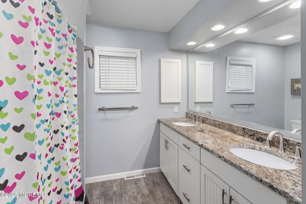 Bathroom, Dual Sink Vanities, Interior, Recessed Lighting, Wood Texture Flooring