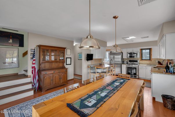 Dining room, Interior, Kitchen, Pendant Lights, Stainless Steel Appliances, Wood Texture Flooring