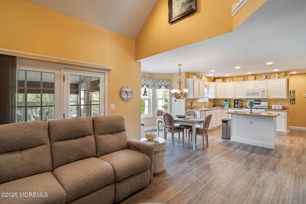 Chandelier, Dining room, Interior, Kitchen, Living room, Recessed Lighting, Wood Texture Flooring