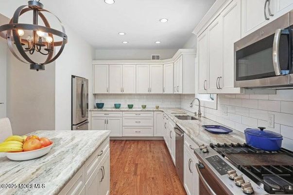 Chandelier, Interior, Kitchen, Recessed Lighting, Stainless Steel Appliances, Wood Texture Flooring