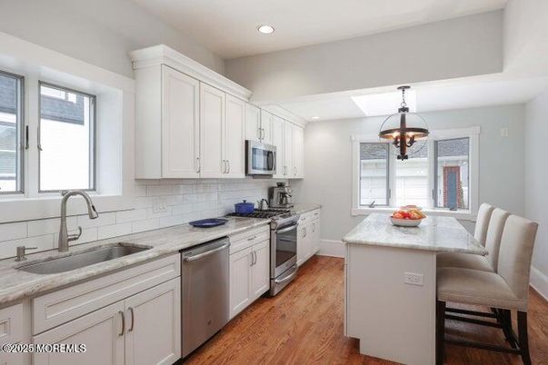 Chandelier, Interior, Kitchen, Recessed Lighting, Stainless Steel Appliances, Wood Texture Flooring