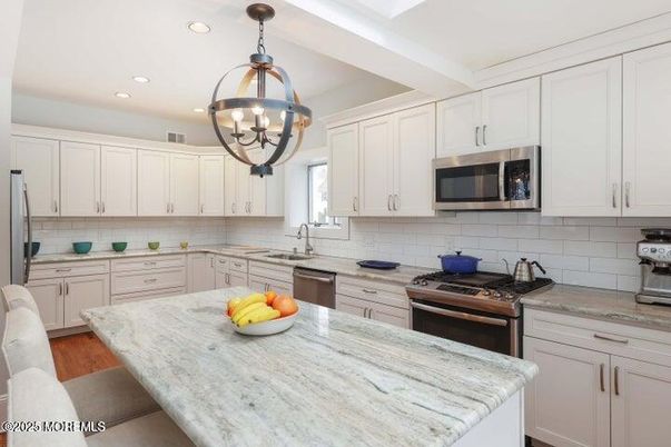 Chandelier, Interior, Kitchen, Pendant Lights, Recessed Lighting, Stainless Steel Appliances, Wood Texture Flooring
