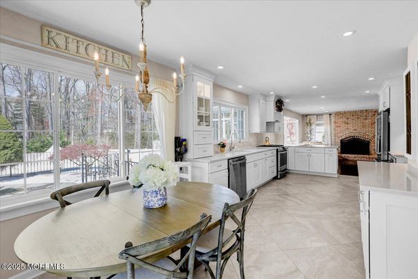 Dining room, Fireplace, Interior, Kitchen, Pendant Lights, Recessed Lighting, Stainless Steel Appliances, Stone Walls