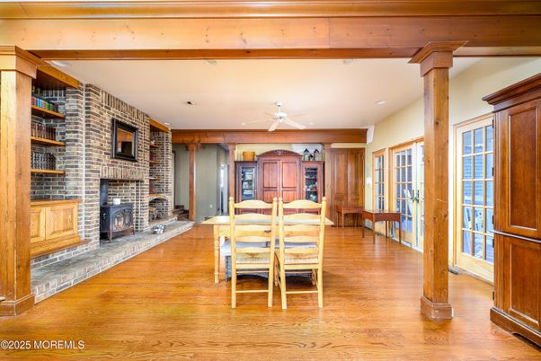 Dining room, Fireplace, Interior, Recessed Lighting, Stone Walls, Wooden Beams, Wood Texture Flooring