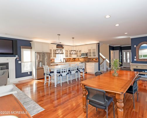 Dining room, Interior, Kitchen, Pendant Lights, Recessed Lighting, Stainless Steel Appliances, Wood Texture Flooring