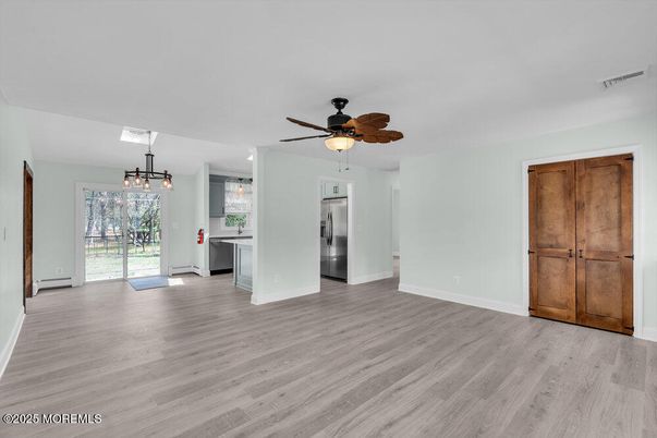 Chandelier, Empty room, Interior, Kitchen, Pendant Lights, Stainless Steel Appliances, Wood Texture Flooring