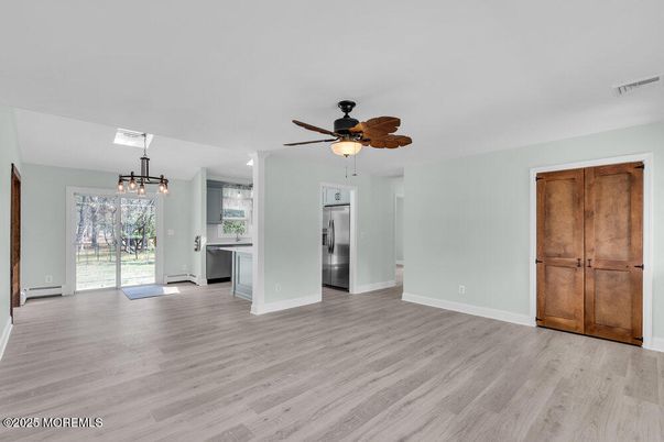 Chandelier, Empty room, Interior, Kitchen, Pendant Lights, Stainless Steel Appliances, Wood Texture Flooring