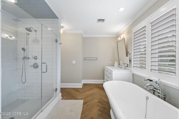 Bathroom, Dual Sink Vanities, Free Standing Baths, Glass Shower, Interior, Recessed Lighting, Wood Texture Flooring