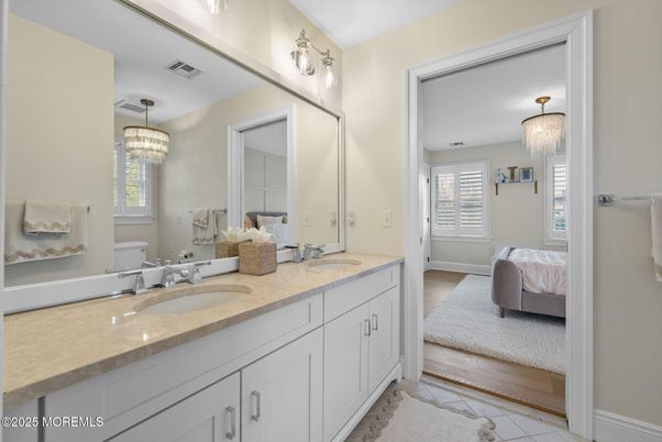 Bathroom, Bedroom, Chandelier, Dual Sink Vanities, Interior, Wood Texture Flooring