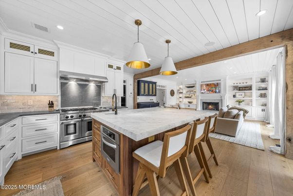 Fireplace, Interior, Kitchen, Living room, Pendant Lights, Recessed Lighting, Stainless Steel Appliances, Wooden Beams, Wood Texture Flooring
