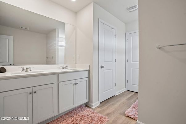 Bathroom, Dual Sink Vanities, Interior, Recessed Lighting, Wood Texture Flooring